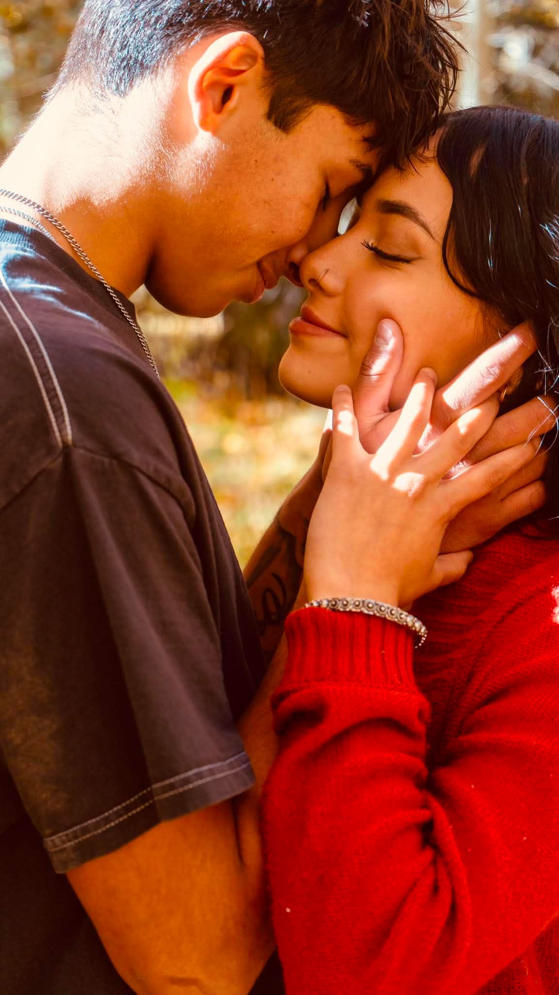 A close, tender couple portrait in golden light