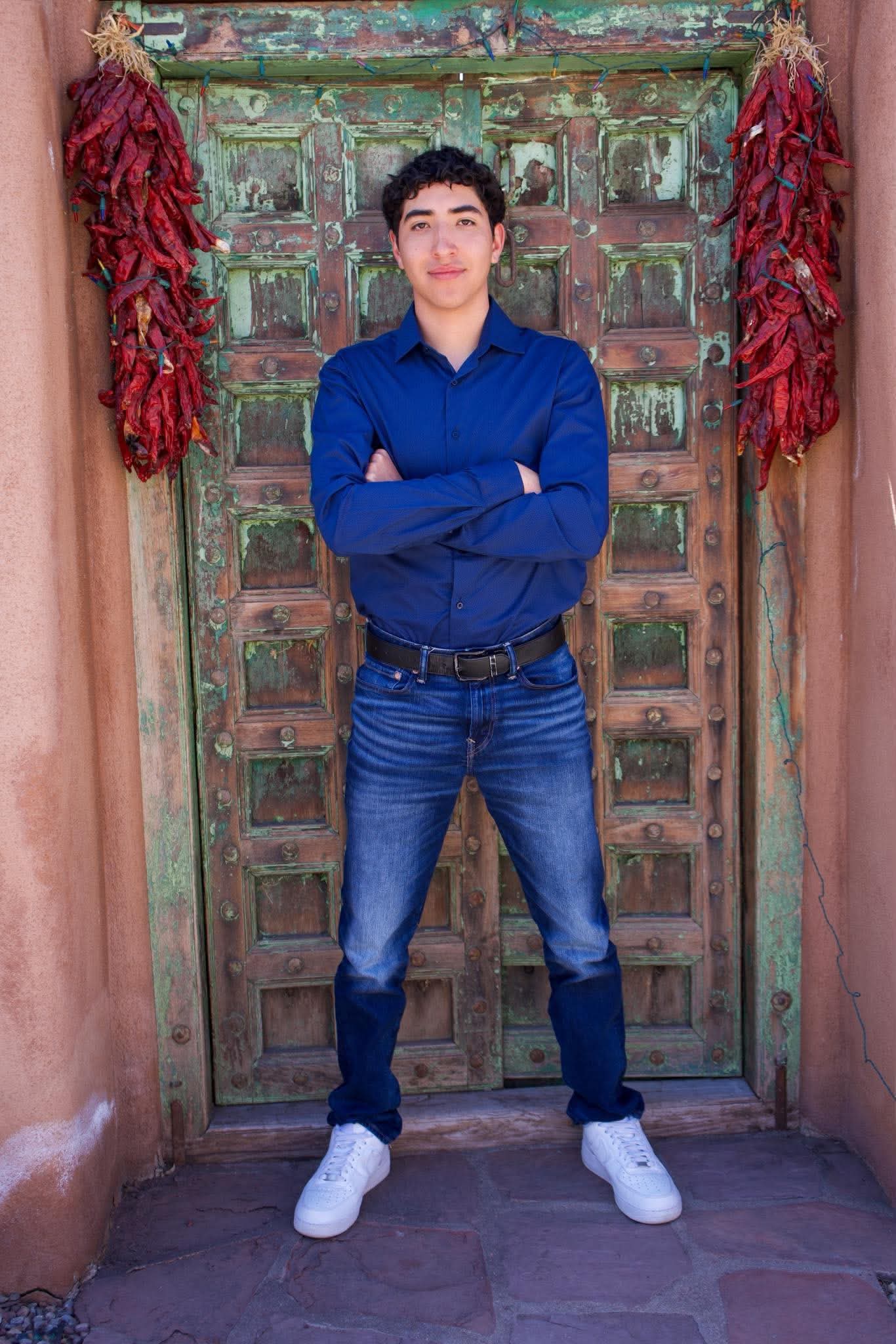 Full senior portrait at an adobe doorway
